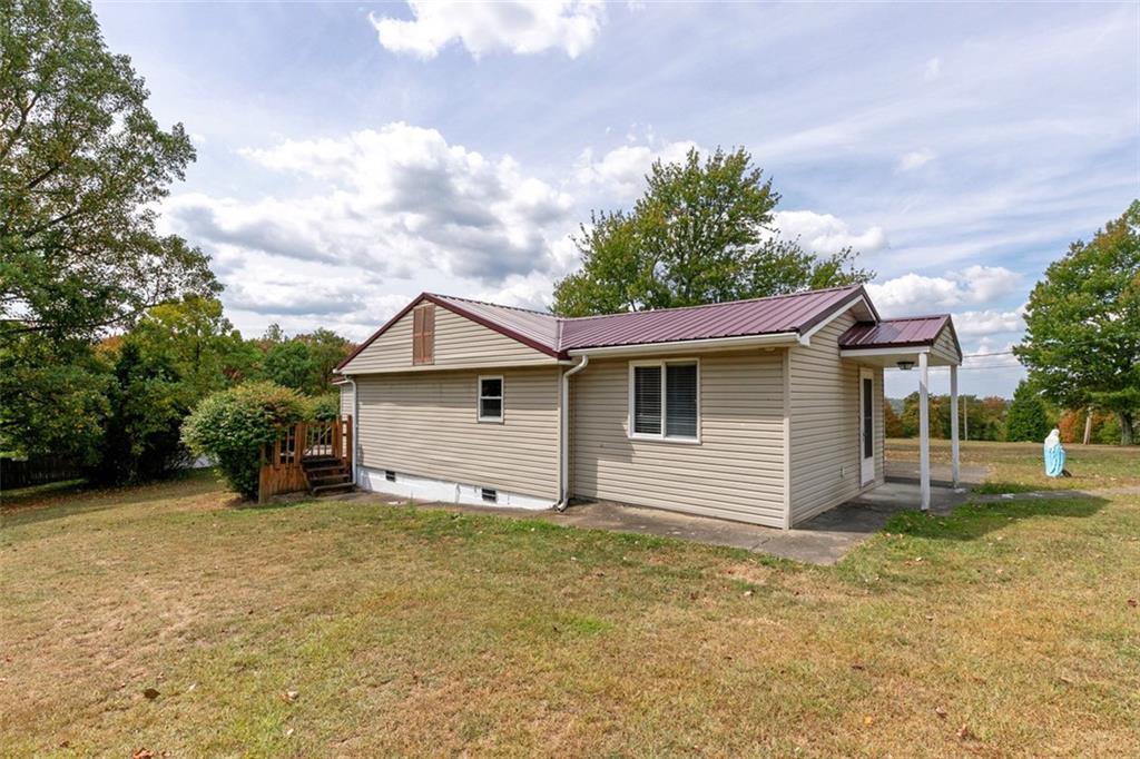 320 Cemetery Road Perryopolis, PA 15473 - Photo 2 of 18 a view of a house with a yard