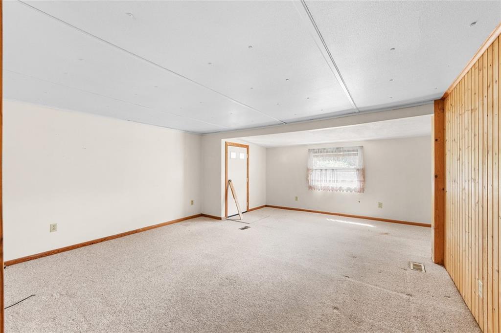 320 Cemetery Road Perryopolis, PA 15473 - Photo 8 of 18 a view of an empty room with a window