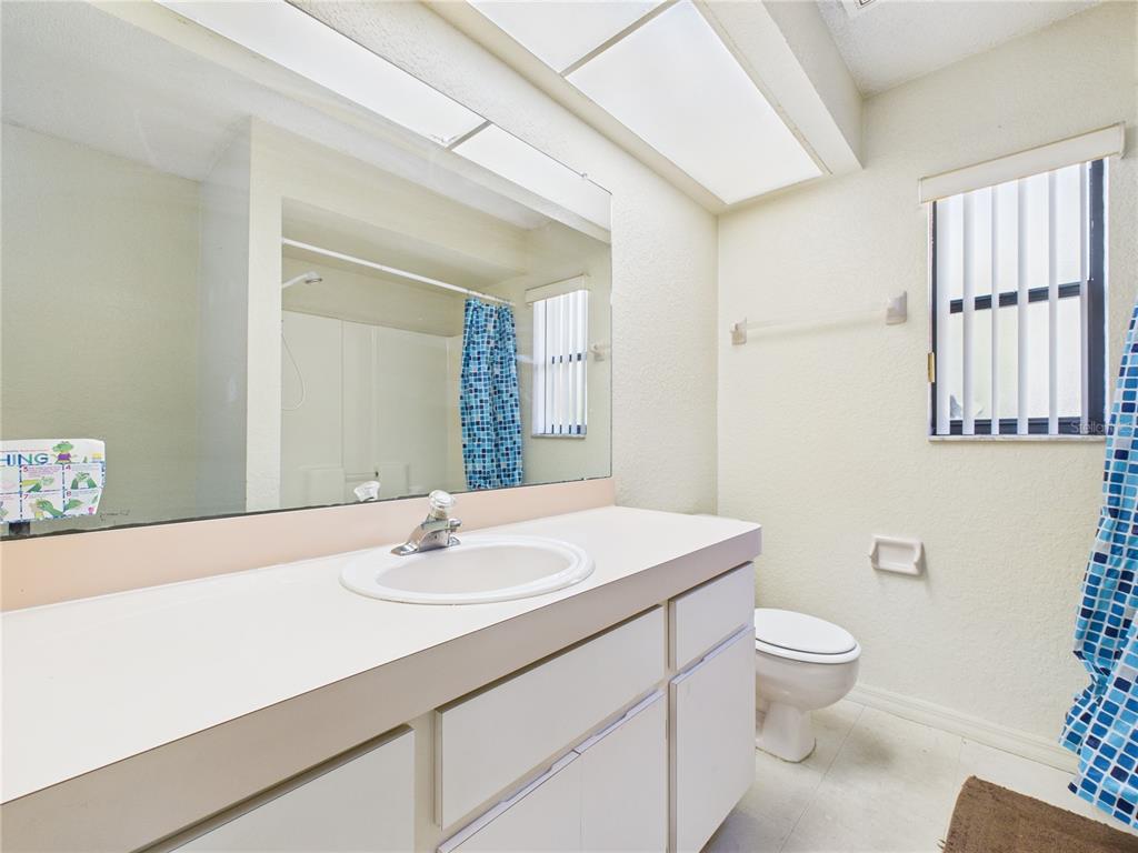 4116 Jason Road Spring Hill, FL 34608 - Photo 19 of 66 a bathroom with a sink toilet and shower