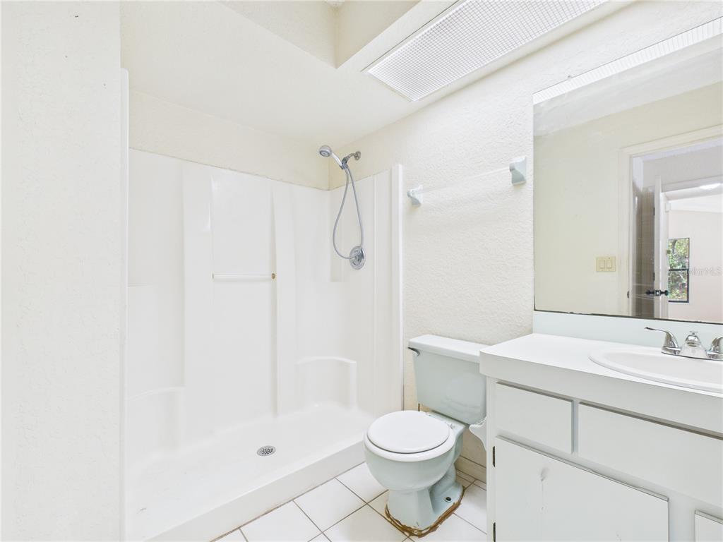 4116 Jason Road Spring Hill, FL 34608 - Photo 22 of 66 a bathroom with a sink a toilet and shower