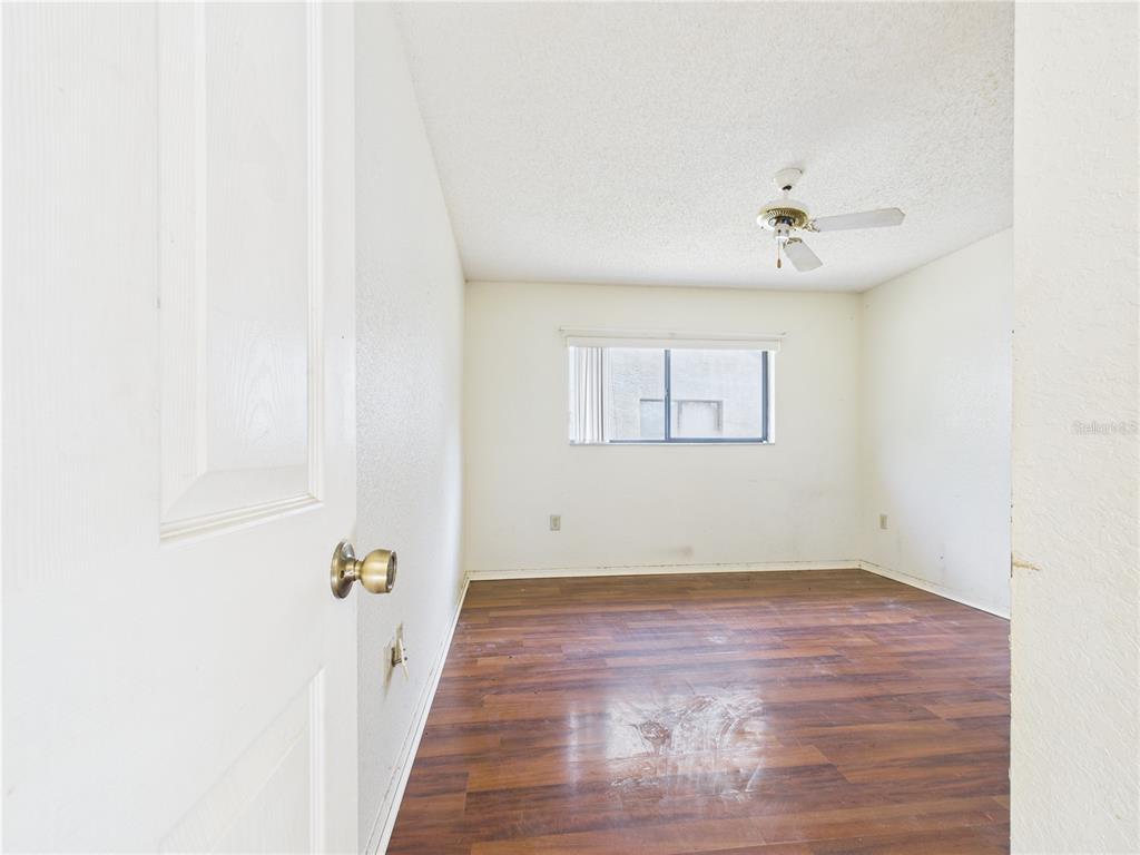 4116 Jason Road Spring Hill, FL 34608 - Photo 50 of 66 a view of room with hardwood floor and ceiling fan