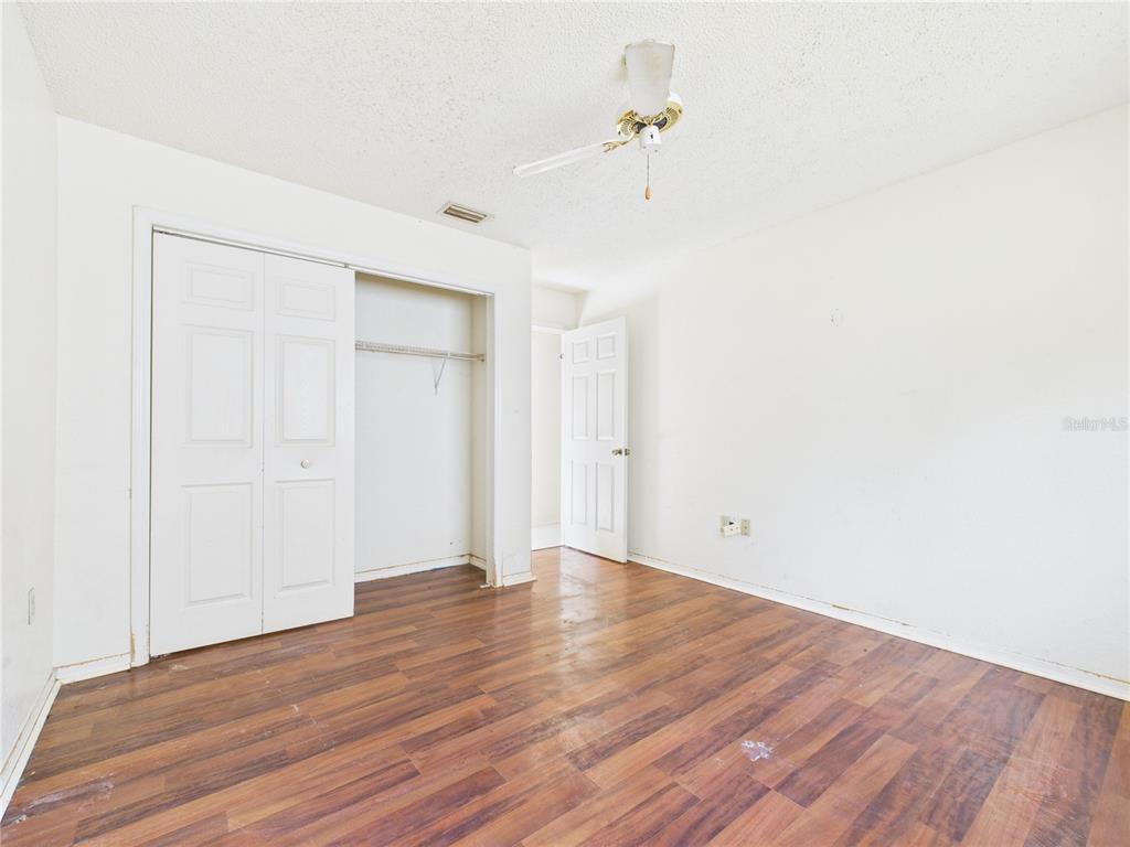 4116 Jason Road Spring Hill, FL 34608 - Photo 51 of 66 a view of an empty room with wooden floor