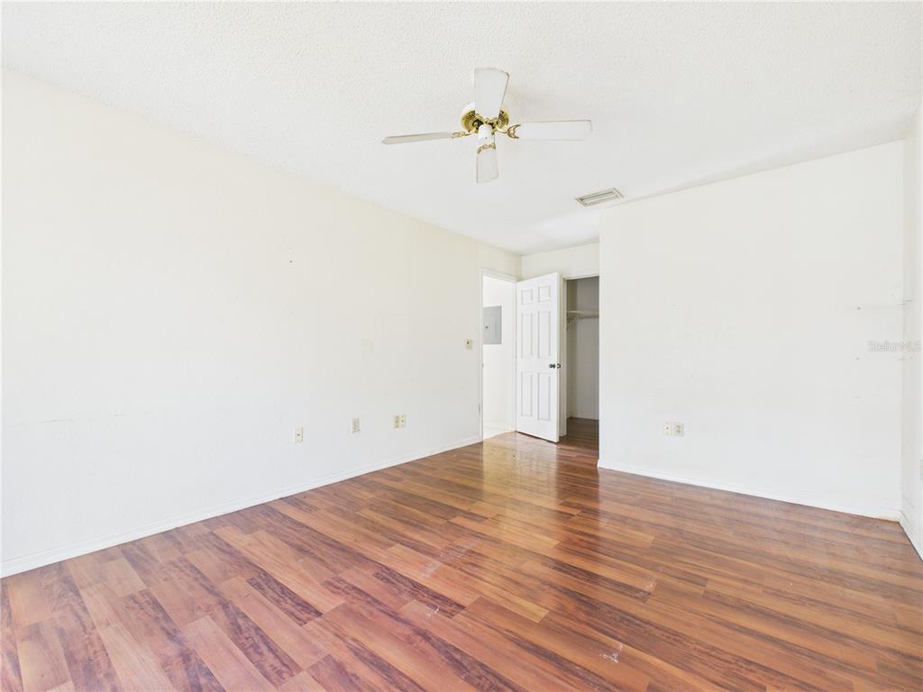 4116 Jason Road Spring Hill, FL 34608 - Photo 55 of 66 a view of an empty room with wooden floor