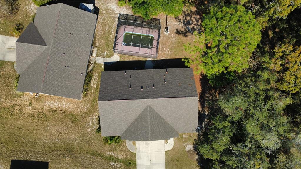 4116 Jason Road Spring Hill, FL 34608 - Photo 59 of 66 a aerial view of a house with a yard