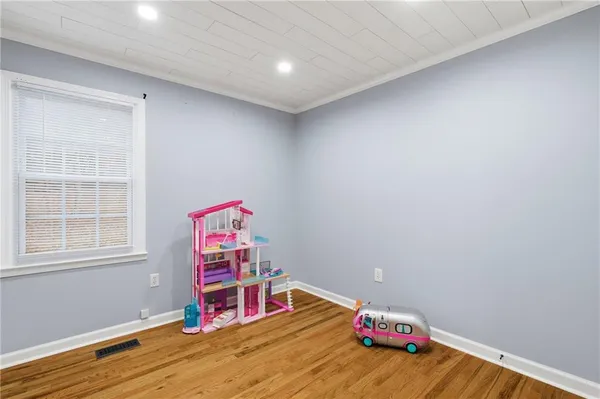 a room with toys and wooden floor