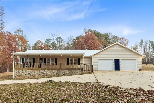 a house with trees in the background