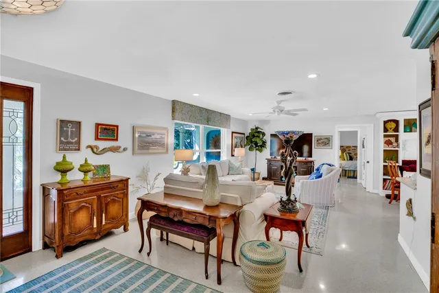 a living room with furniture and a table