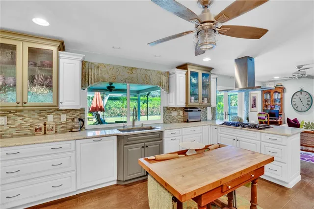 a open kitchen with a table and chairs in it