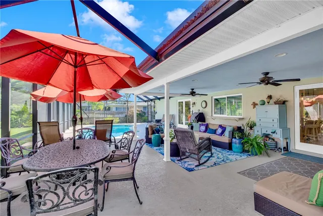 a view of a swimming pool with a patio
