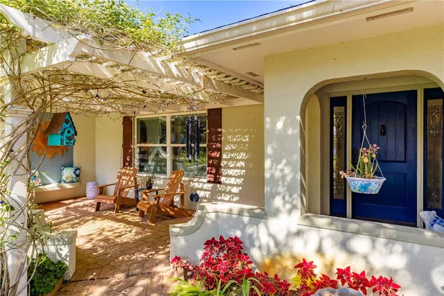 a group of people sitting in front of a building