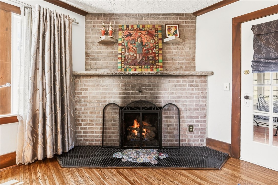 66 Hardison Road Irondequoit, NY 14617 - Photo 8 of 28 Cozy gas fireplace with brick surround and custom
