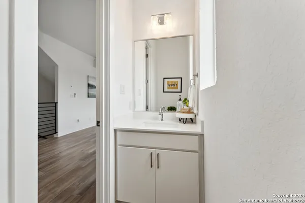 a bathroom with a sink and a mirror