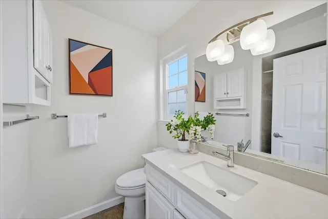 a bedroom with a bed and a table in it