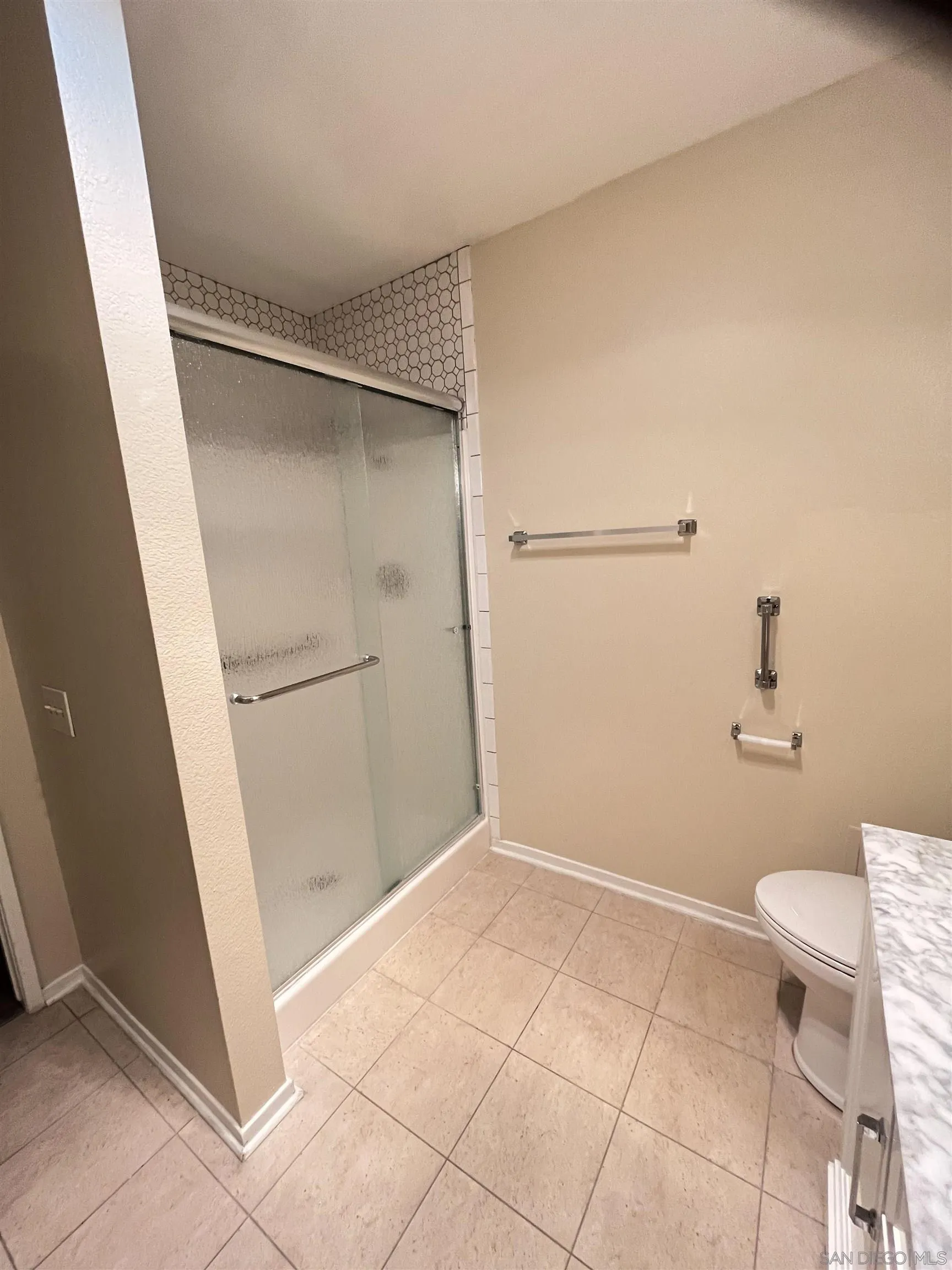 3719 Bay Leaf Way Oceanside, CA 92057 - Photo 13 of 33 a bathroom with a shower and toilet