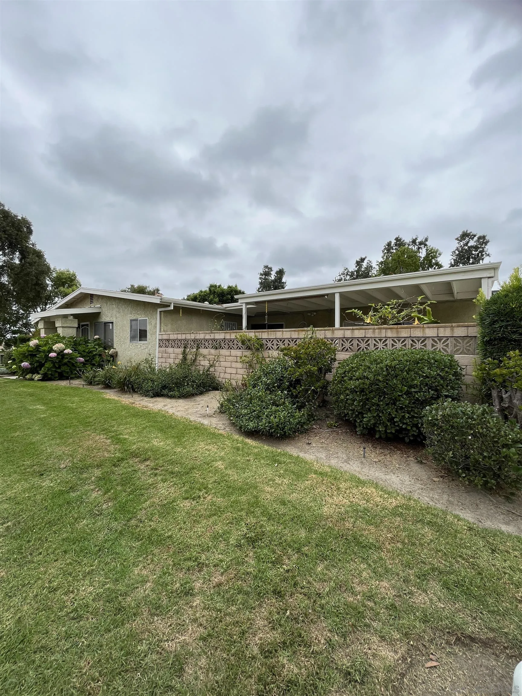 3719 Bay Leaf Way Oceanside, CA 92057 - Photo 2 of 33 a view of a garden with plants and large trees