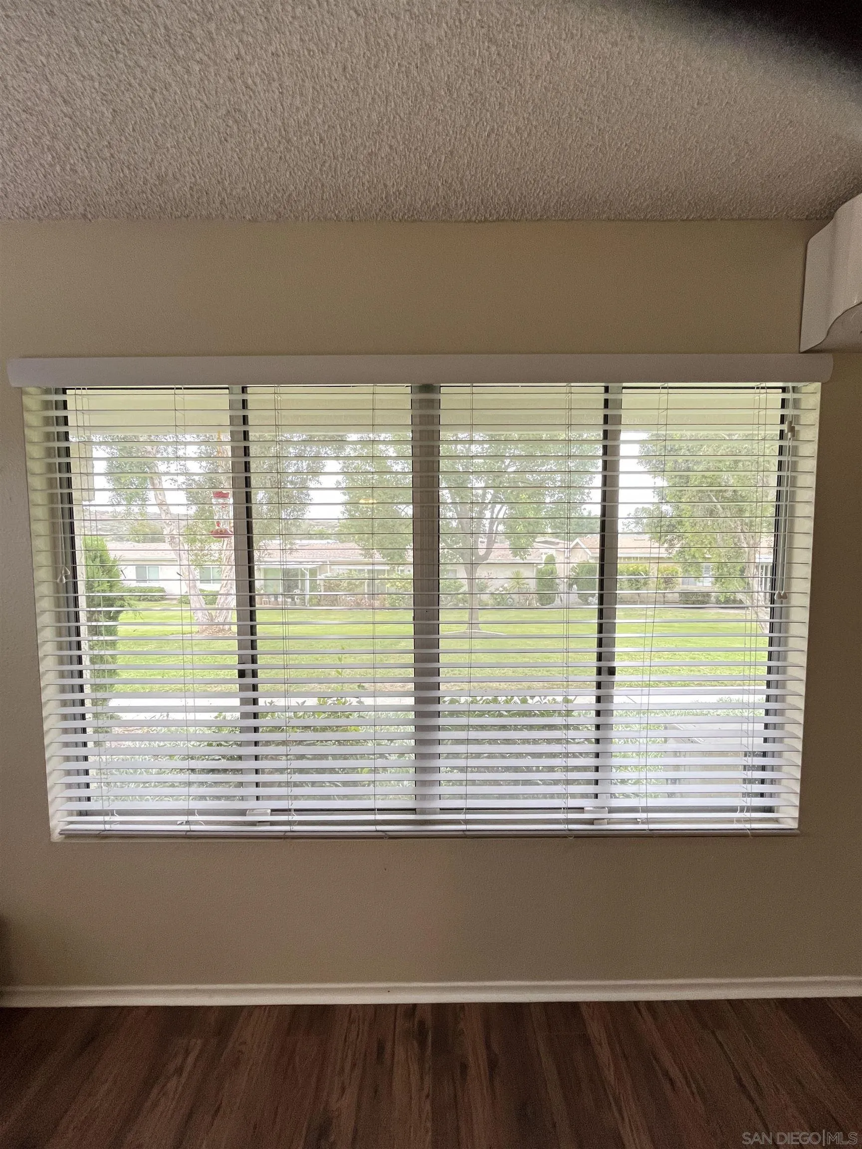 3719 Bay Leaf Way Oceanside, CA 92057 - Photo 6 of 33 a view of a window and an empty room