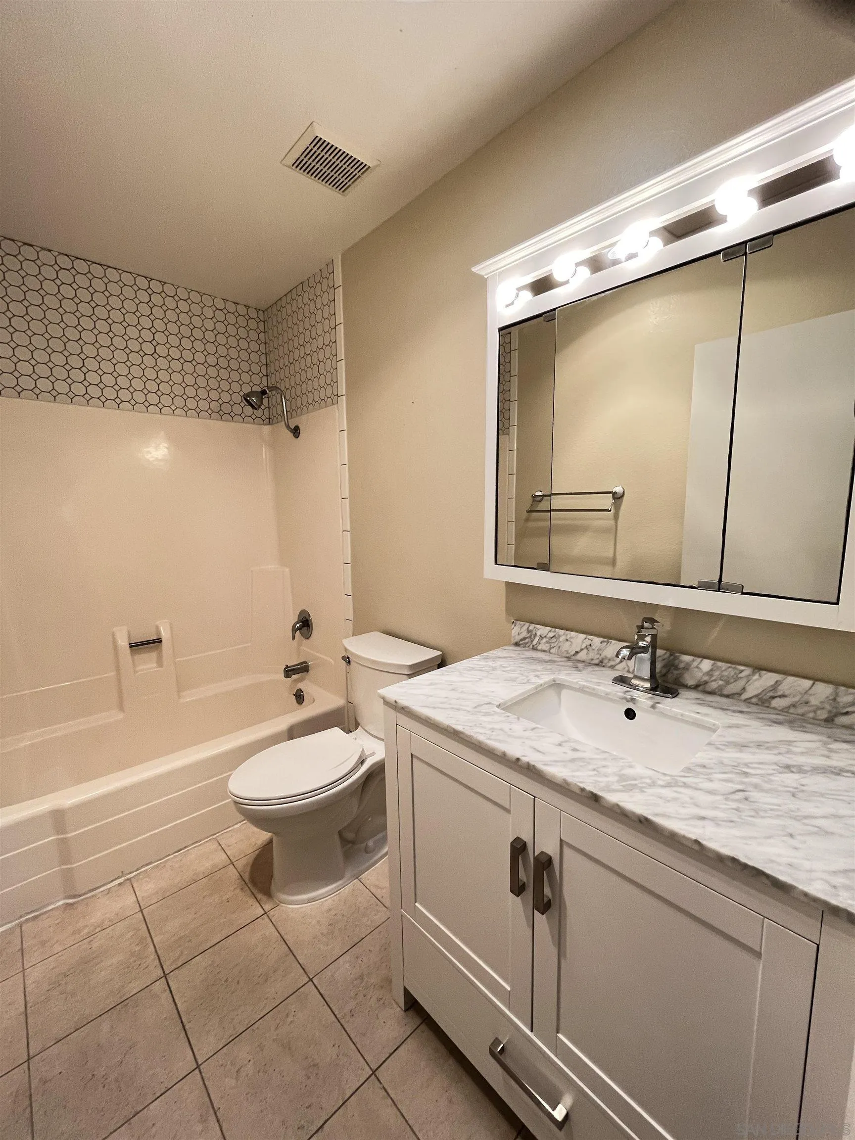 3719 Bay Leaf Way Oceanside, CA 92057 - Photo 10 of 33 a bathroom with a sink a toilet and shower