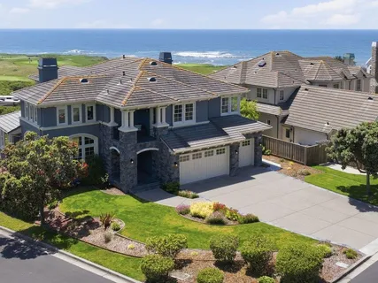 an aerial view of a house with a garden and plants