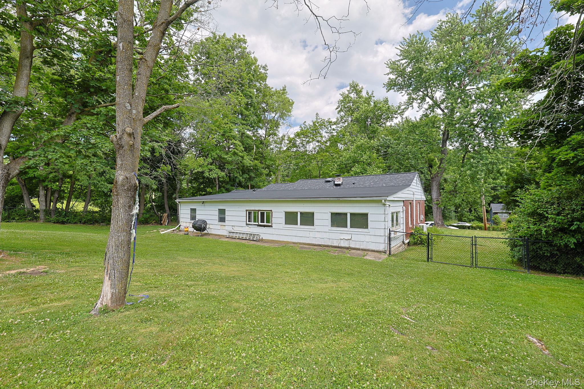 178 Mt Airy Road New Windsor, NY 12553 - Photo 27 of 31 a front view of house with a garden and trees