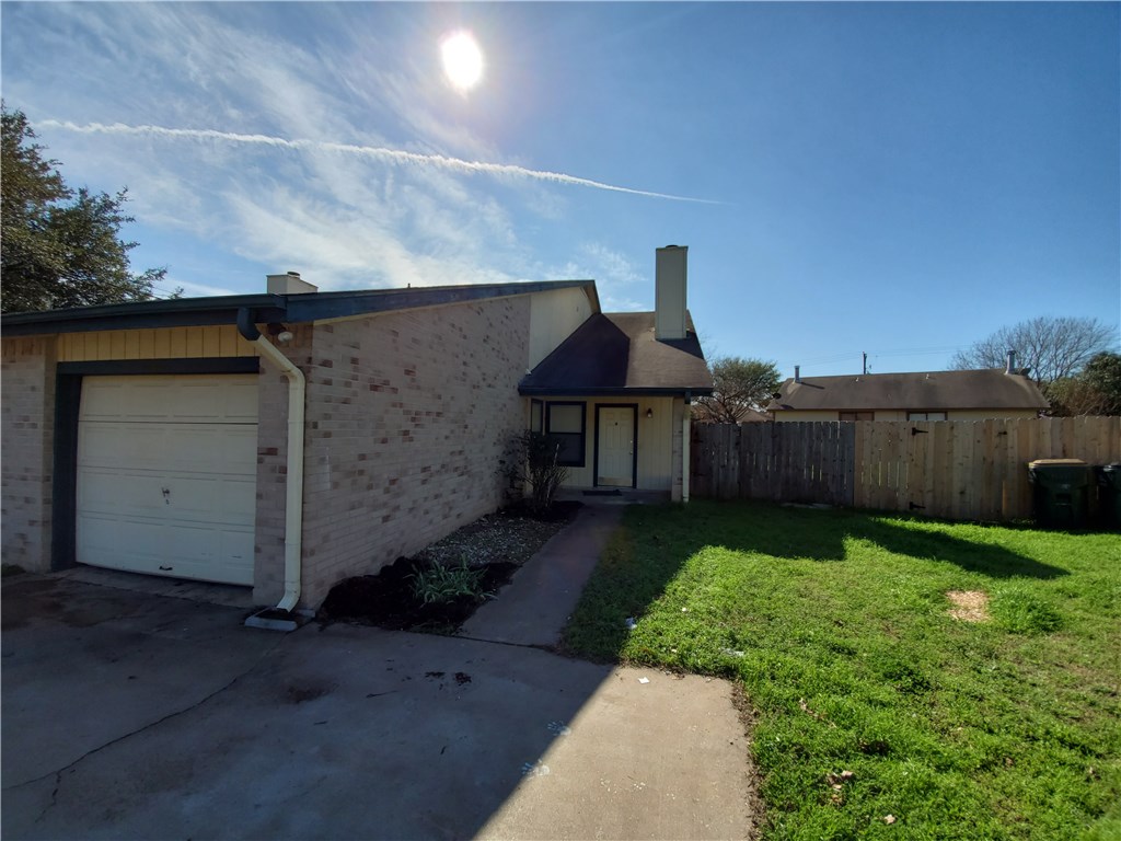 108 Verna Spur, Unit B Georgetown, TX 78628 - Photo 1 of 1 a front view of a house with garden