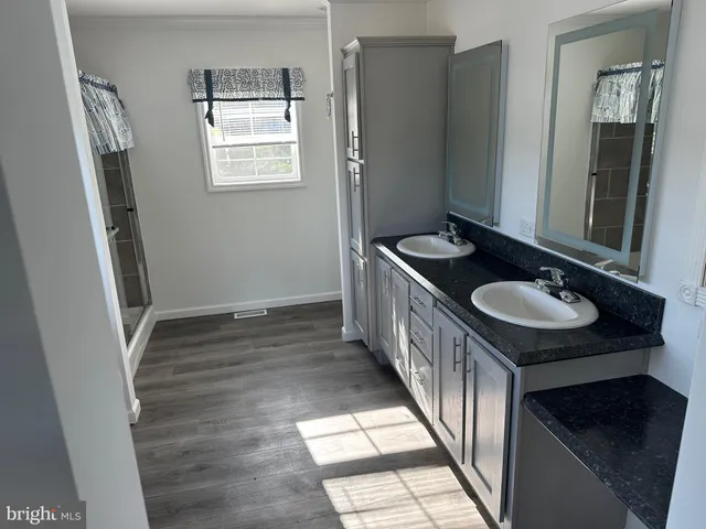 a bathroom with a glass door shower
