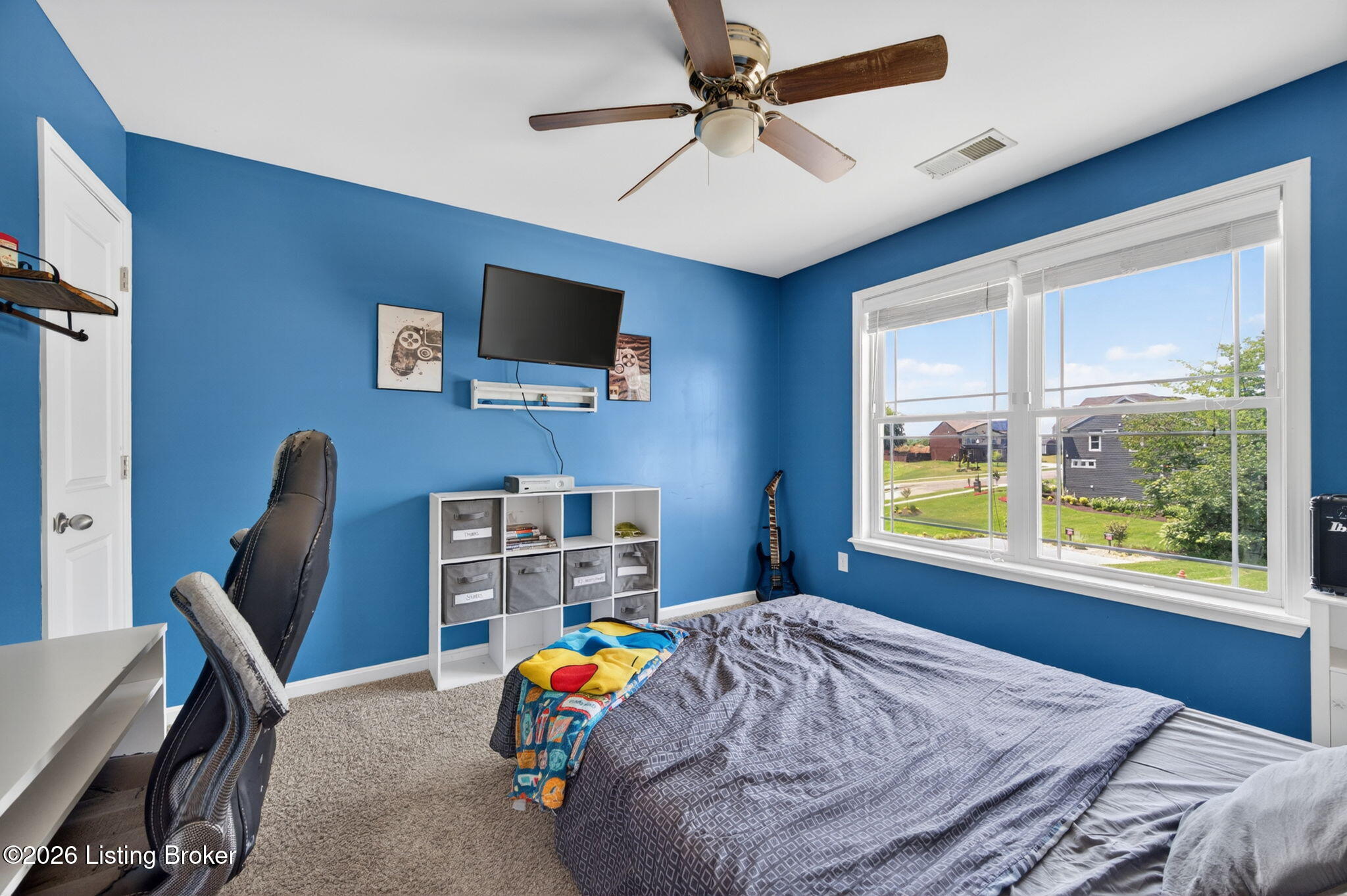 142 Highland Ridge Drive Mount Washington, KY 40047 - Photo 32 of 61 This spacious bedroom features carpet flooring, a ceiling fan with light kit, and a large window with neighborhood views