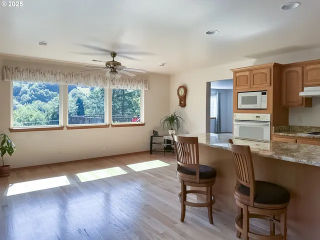 a workspace with furniture window and wooden floor