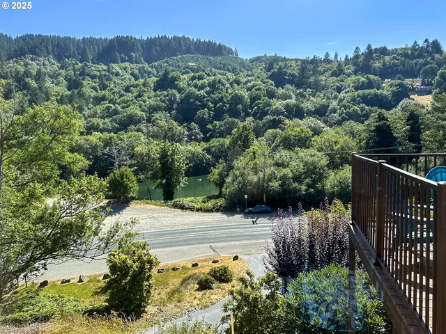 a view of a street with a small yard