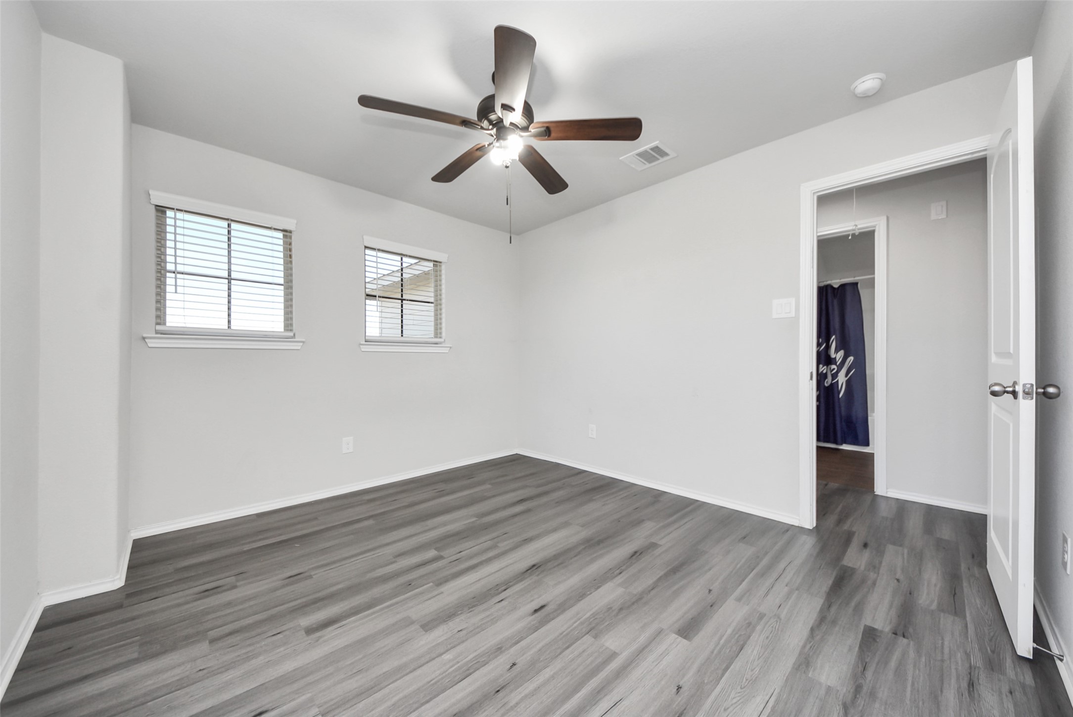 1227 Baja Vista Way Channelview, TX 77530 - Photo 20 of 25 wooden floor in an empty room with a window
