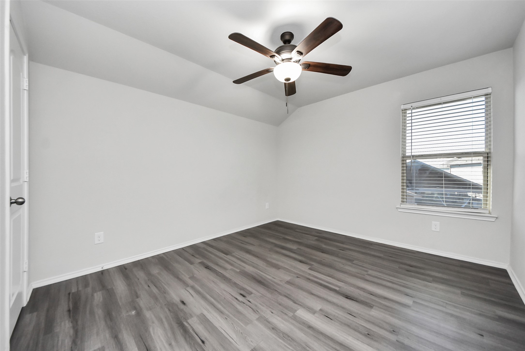 1227 Baja Vista Way Channelview, TX 77530 - Photo 21 of 25 an empty room with wooden floor and windows