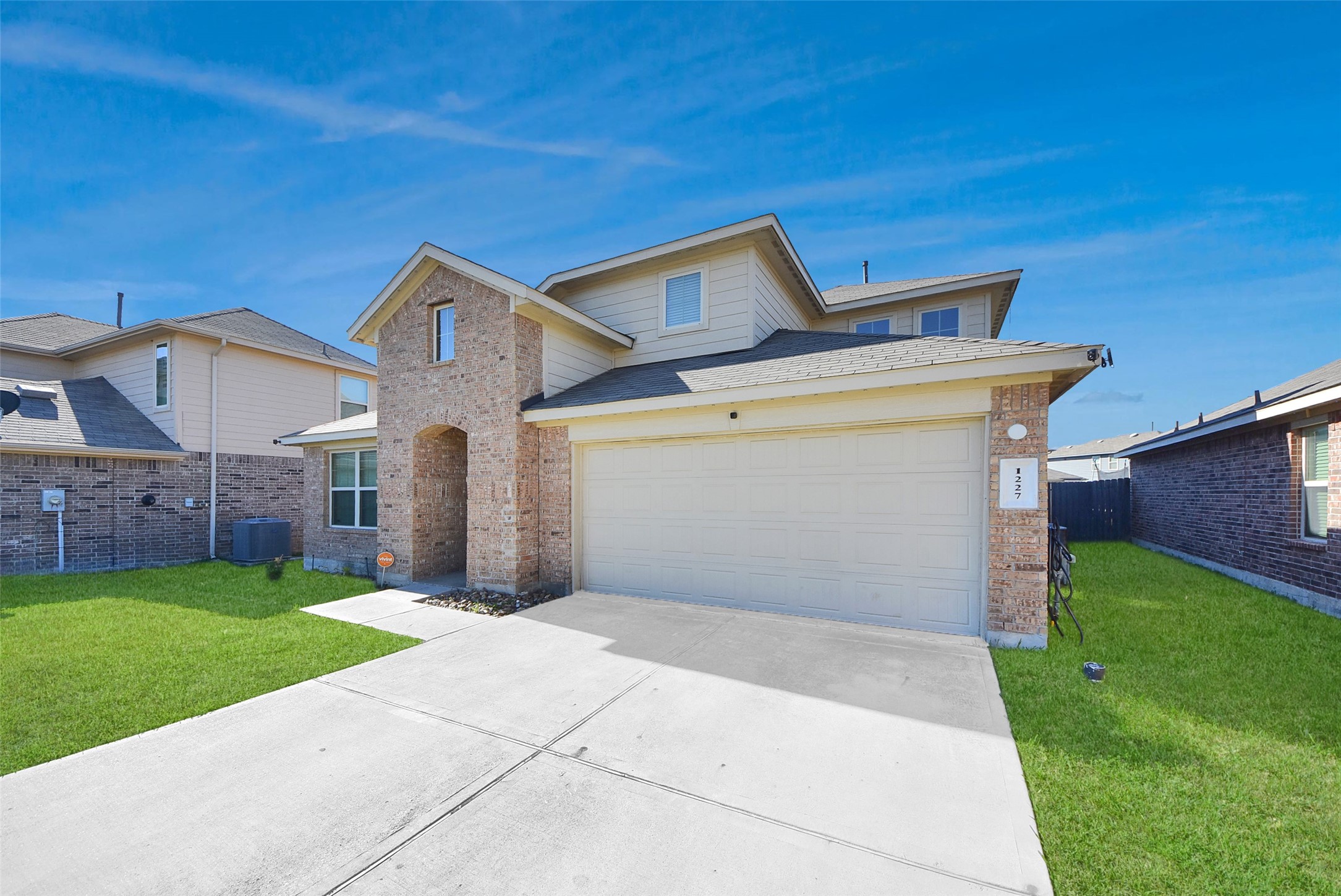 1227 Baja Vista Way Channelview, TX 77530 - Photo 3 of 25 a front view of a house with a yard