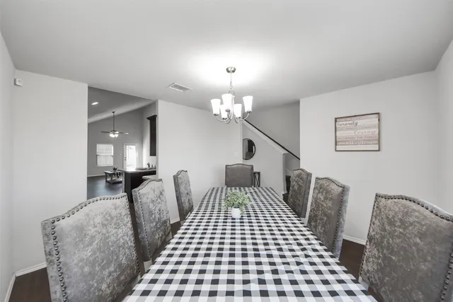 a bedroom with furniture and a chandelier