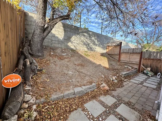 a view of outdoor space with wooden fence