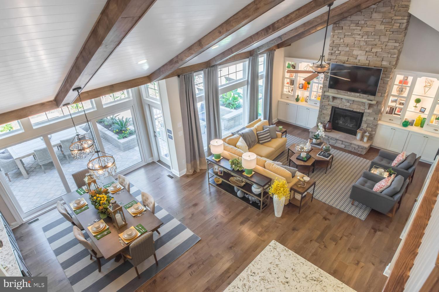 25027 Leland Avenue Harbeson, DE 19951 - Photo 14 of 21 a living room with furniture and a floor to ceiling window or wooden floor