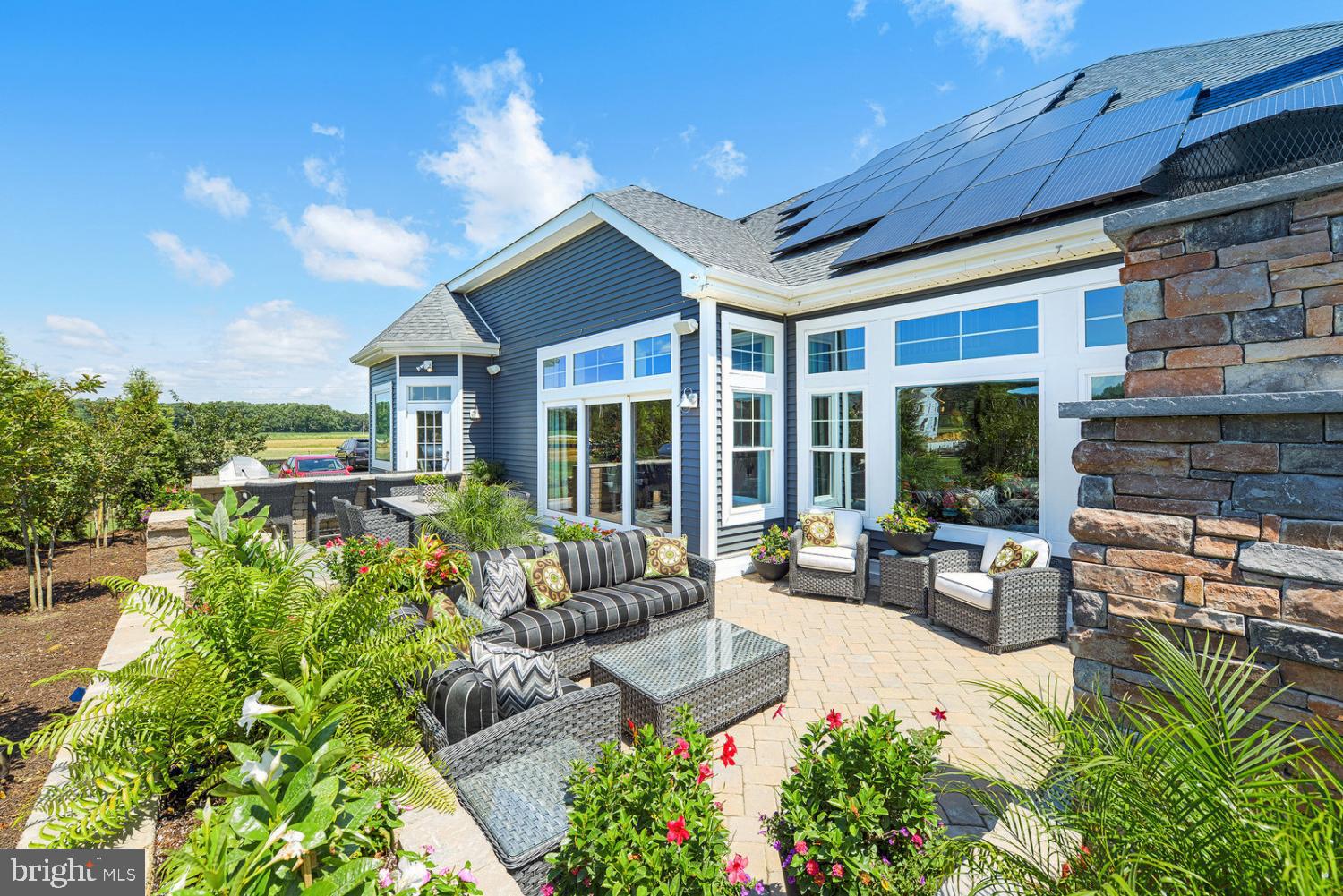 25027 Leland Avenue Harbeson, DE 19951 - Photo 18 of 21 a building outdoor space with patio furniture and potted plants