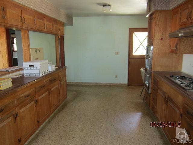 15 Vientos Road Camarillo, CA 93010 - Photo 12 of 25 a bathroom with a granite countertop sink a toilet and a mirror