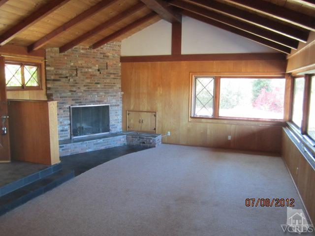 15 Vientos Road Camarillo, CA 93010 - Photo 3 of 25 an empty room with windows fire place and refrigerator