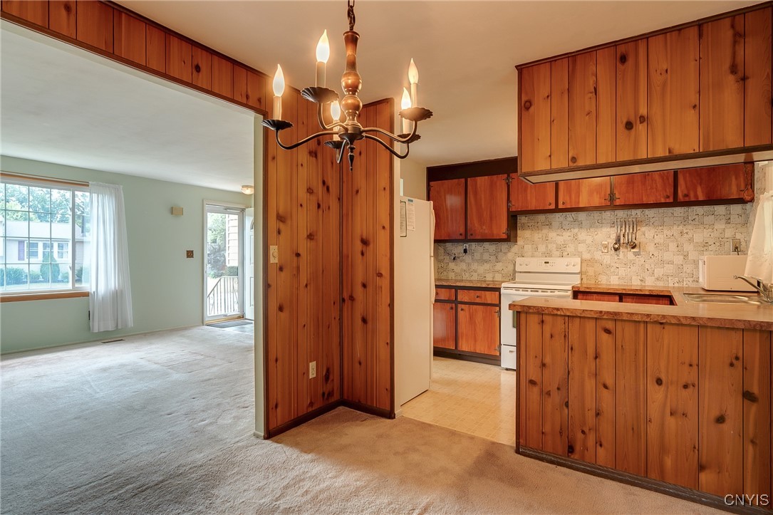 511 Rita Drive Clay, NY 13212 - Photo 14 of 41 View from DR into Kitchen and LR