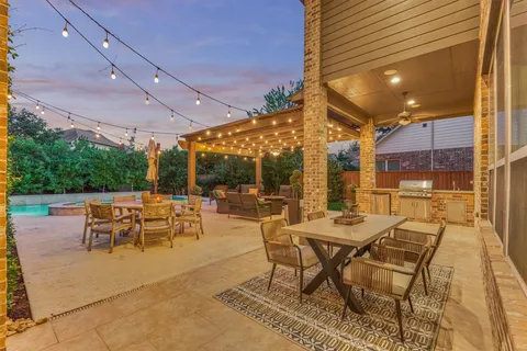 a outdoor space with lots of tables a garden and chairs
