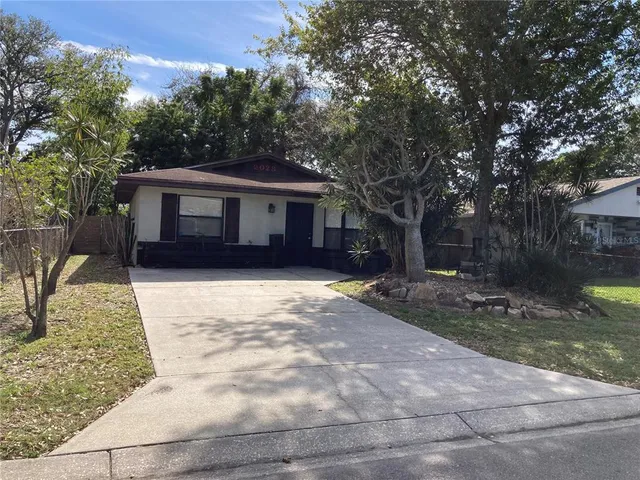 a house with trees in the background