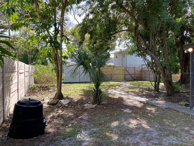 a view of a house with snow next to a road