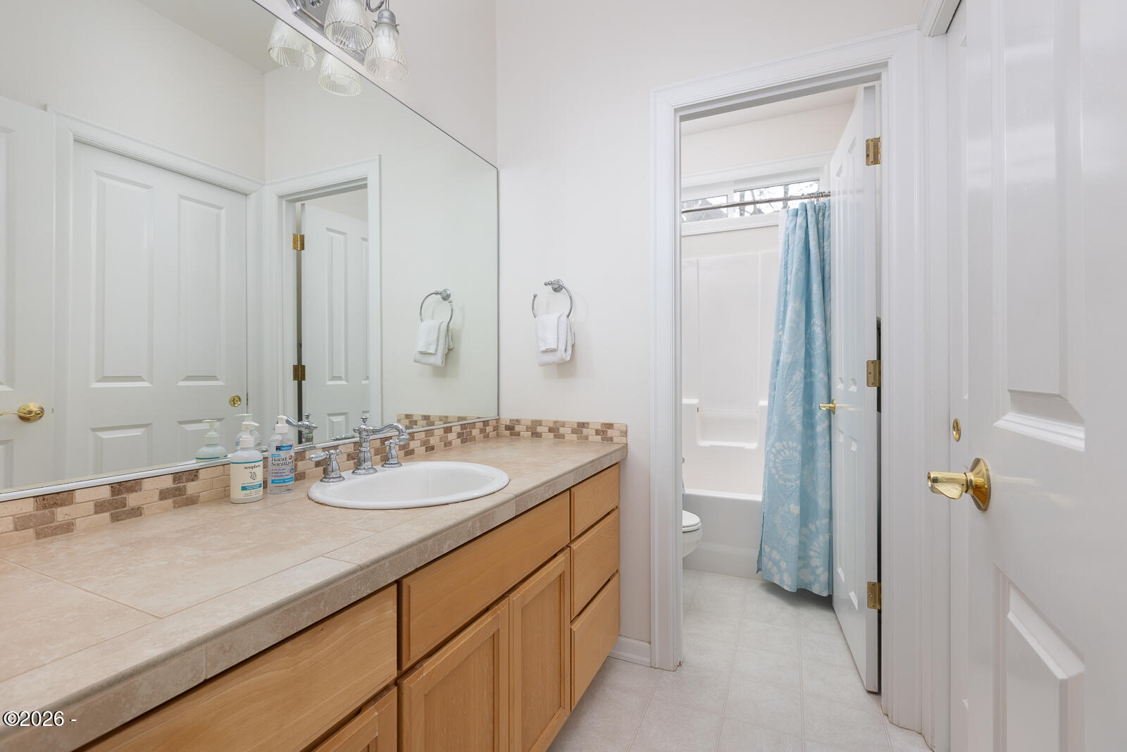 7415 East Summit Road Pacific City, OR 97135 - Photo 27 of 44 a bathroom with a granite countertop sink a toilet and shower