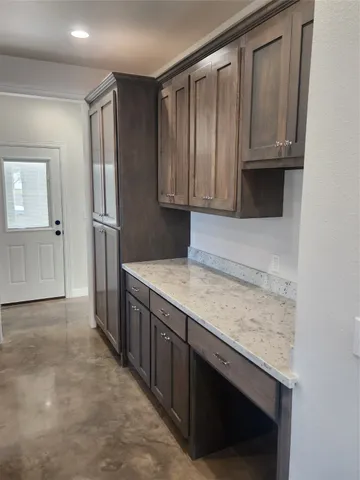 a kitchen with stainless steel appliances a refrigerator a stove a sink dishwasher and a stove