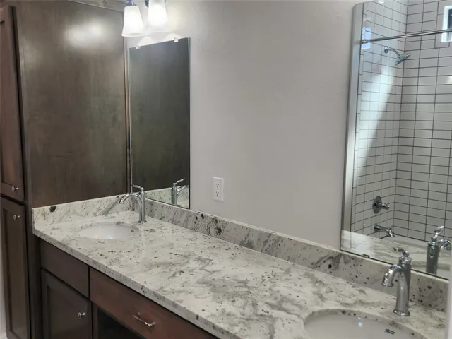 a bathroom with a bathtub and next to a window