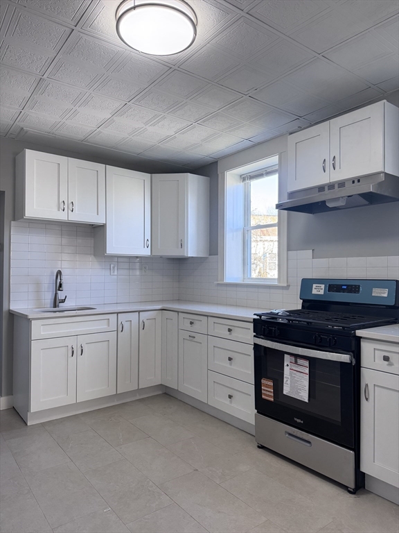36 Endicott Street, Unit 2R Salem, MA 01970 - Photo 5 of 6 a kitchen with cabinets appliances and a sink