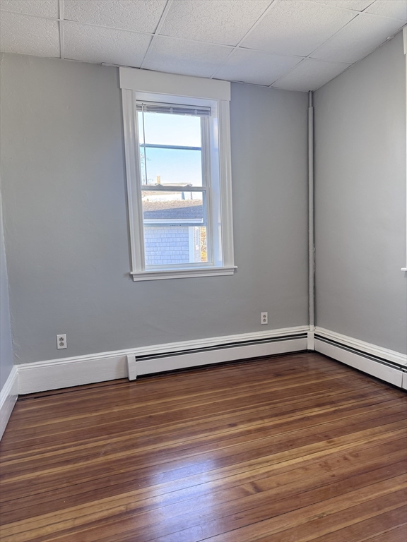 36 Endicott Street, Unit 2R Salem, MA 01970 - Photo 6 of 6 a view of an empty room with wooden floor and a window