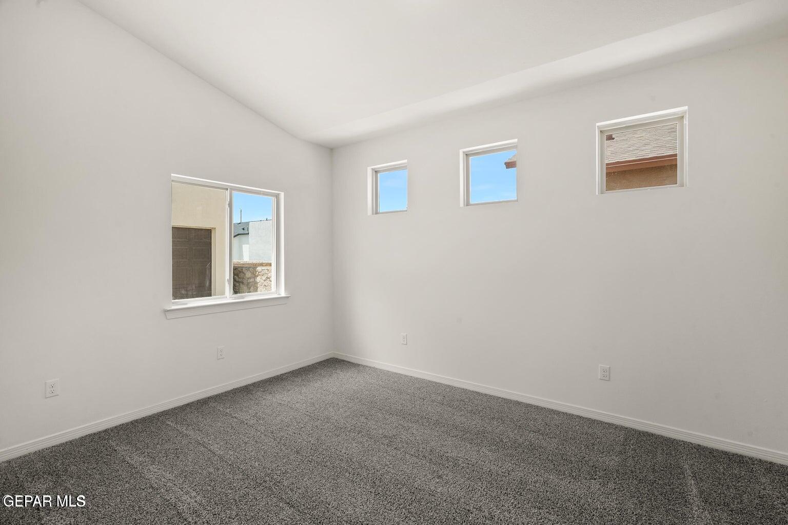 13090 Beccles Street El Paso, TX 79928 - Photo 12 of 23 a view of an empty room with a window