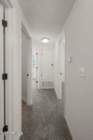 a view of room with a hallway