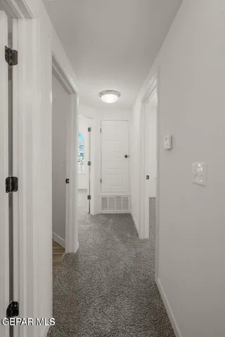 a view of room with a hallway