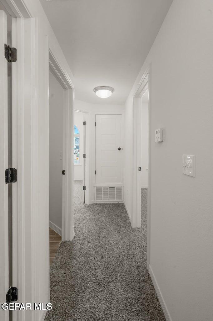13090 Beccles Street El Paso, TX 79928 - Photo 8 of 23 a view of room with a hallway